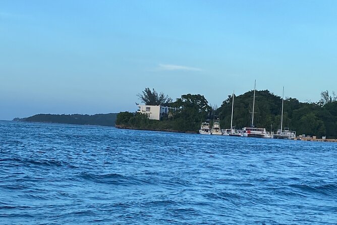 4 Hours Party Boat Catamaran Cruise in Negril - Arriving at Rick’s Cafe near the end