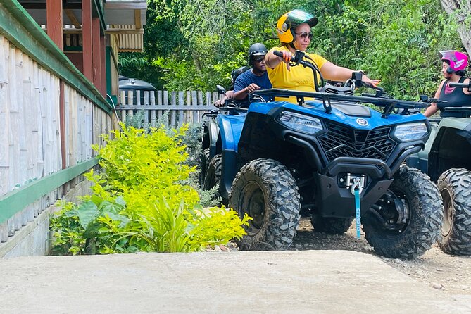 ATV Tour, Limestone Bamboo Rafting and Transportation - Sandy Bay ATV riding through mud and forest