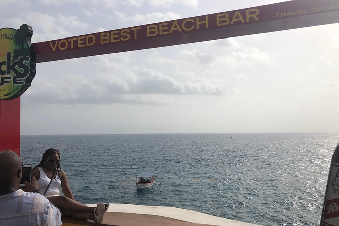 Blue Hole Mineral Springs, Rick's Café, and Shopping Combo Tour - Souvenir shopping around Negril Treehouse