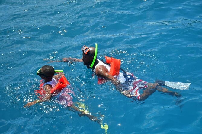 Boatride & Snorkeling then Margaritaville Hipstrip Activity - Getting into the water at the snorkeling site