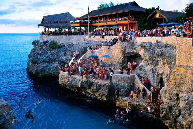 Catamaran Cruise Full Day Tour to Reef, Caves and Negril Beach - Boarding the catamaran means wading into the water