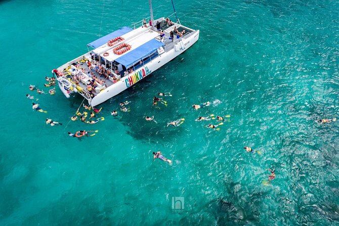 Catamaran Party Cruise and Snorkeling from Montego Bay - Setting sail with music, snacks, and an open bar