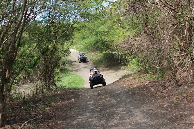 Chukka ATV Safari - Riding dirt trails through tropical forest