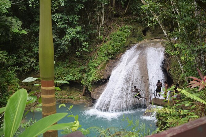 "Explore Scenic Tropical Waterfalls at Blue Hole" - The cave and clay treatment add variety