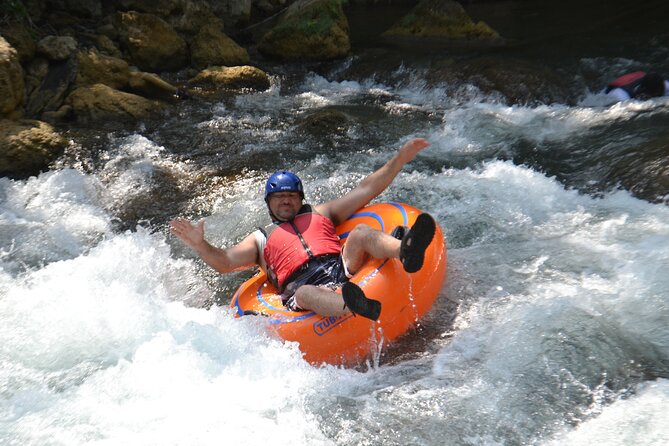 Falmouth Waterfalls River Tubing and Beach Adventure - From tubes to a raft at Bengal Bay