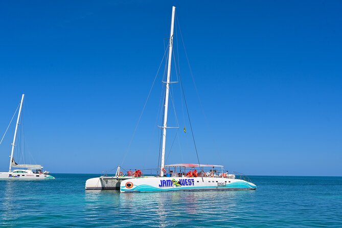 Family Catamaran Cruise from Jamwest Beach Negril Hotels - Sailing with drinks, snacks, and Caribbean views