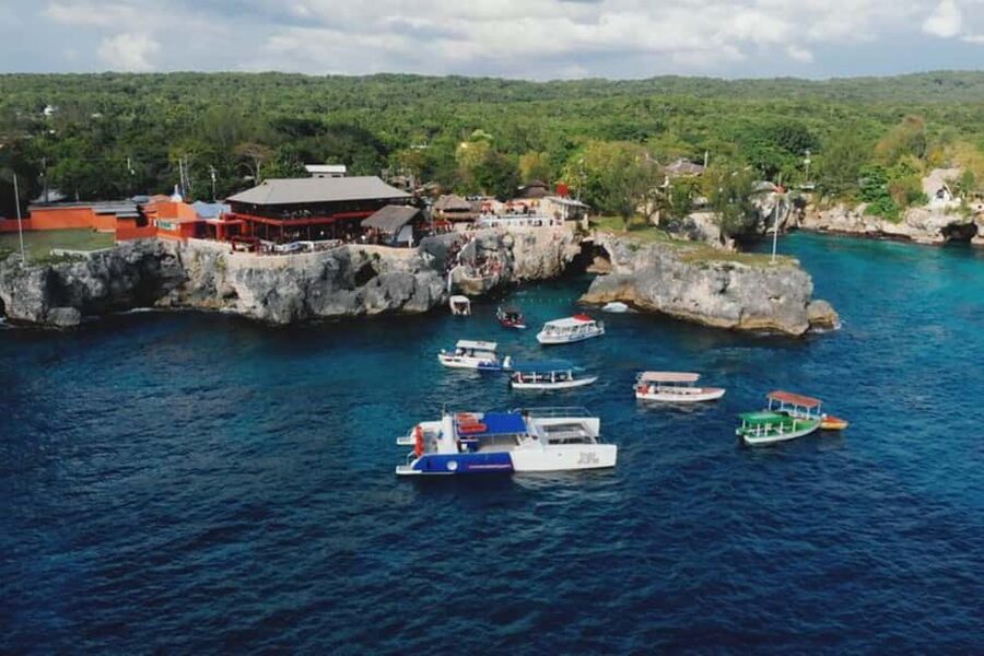 From Montego Bay: Negril Beach and Rick's Café Day Trip - Seven Mile Beach: sand, water, and free time