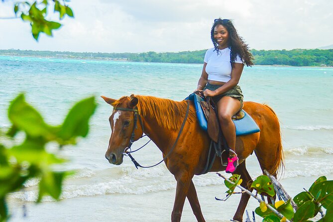 Horseback Riding/Swimming and Dunn's River from Ocho Rios - Riding a horse from forest paths into the sea