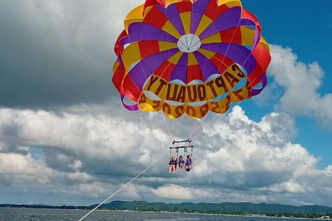 Negrils Seven Miles Beach, Rick's cafe and Parasailing Tour. - The road west through Jamaica