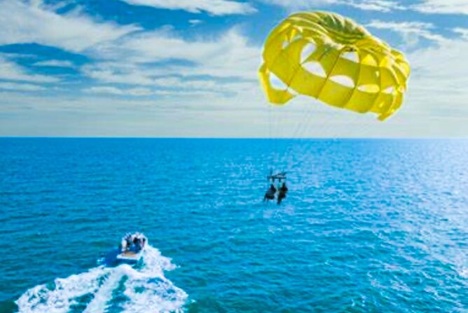 Parasailing above Turquoise Ocean Waters in Montego Bay - Beach Time After You Come Down