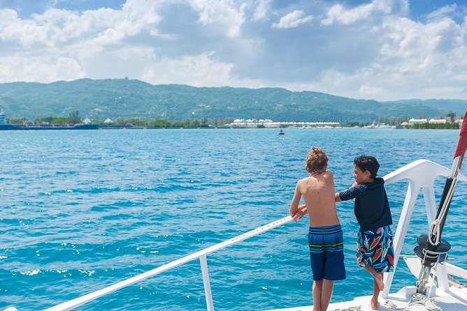 Reggae Family Catamaran Cruise From Montego Bay - Leaving the private dock around 10 a.m.