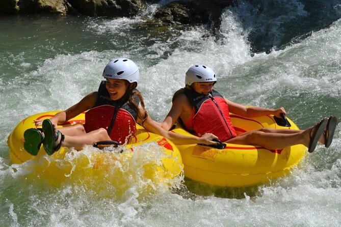 River Rapids Tubing and Beach Visit with Private Transportation - Paddling toward the nearby beach
